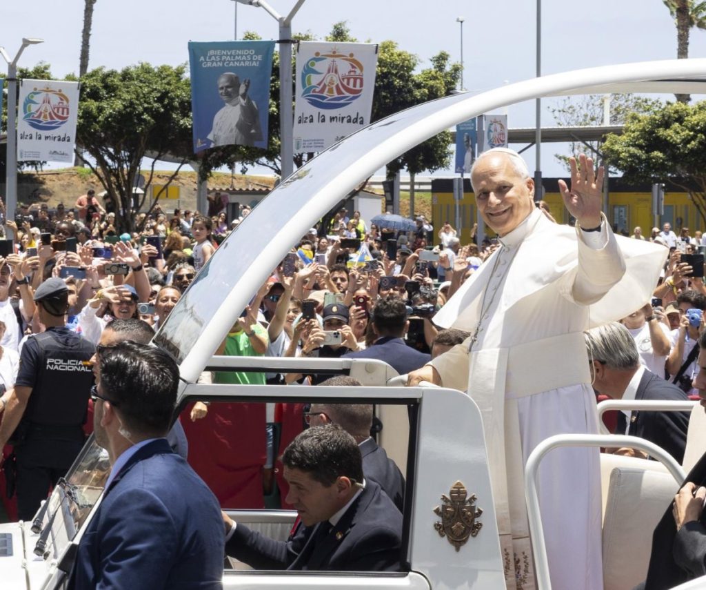 Pope Leo waves to crowd during visit to Canary Islands, meeting migrants and aid workers
