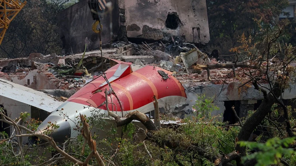Air India Boeing 787 Dreamliner crash site wreckage with charred building debris